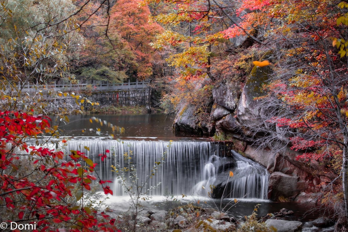 Glass bridge above waterfall